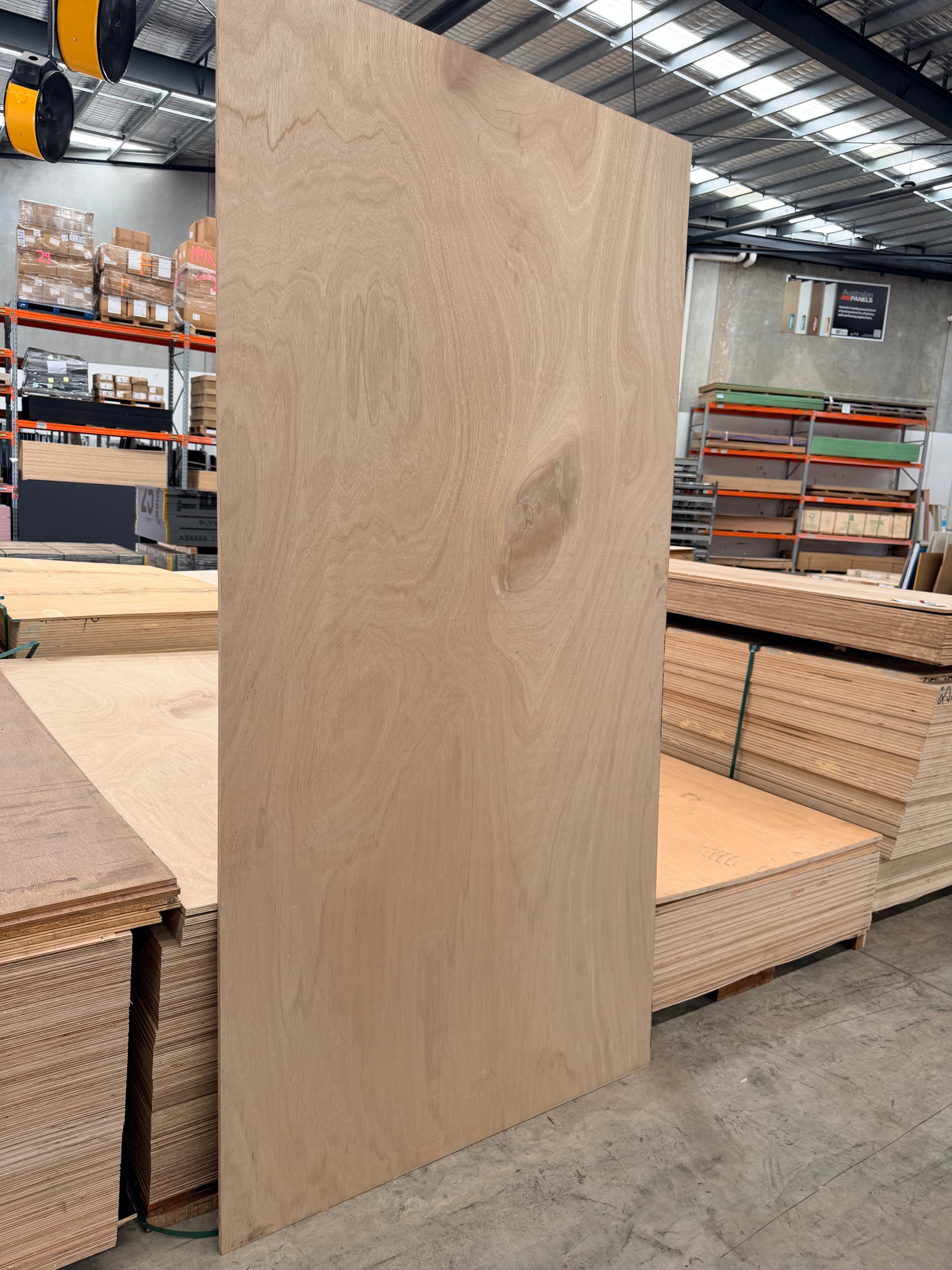 Marine Plywood standing up in a plywood warehouse