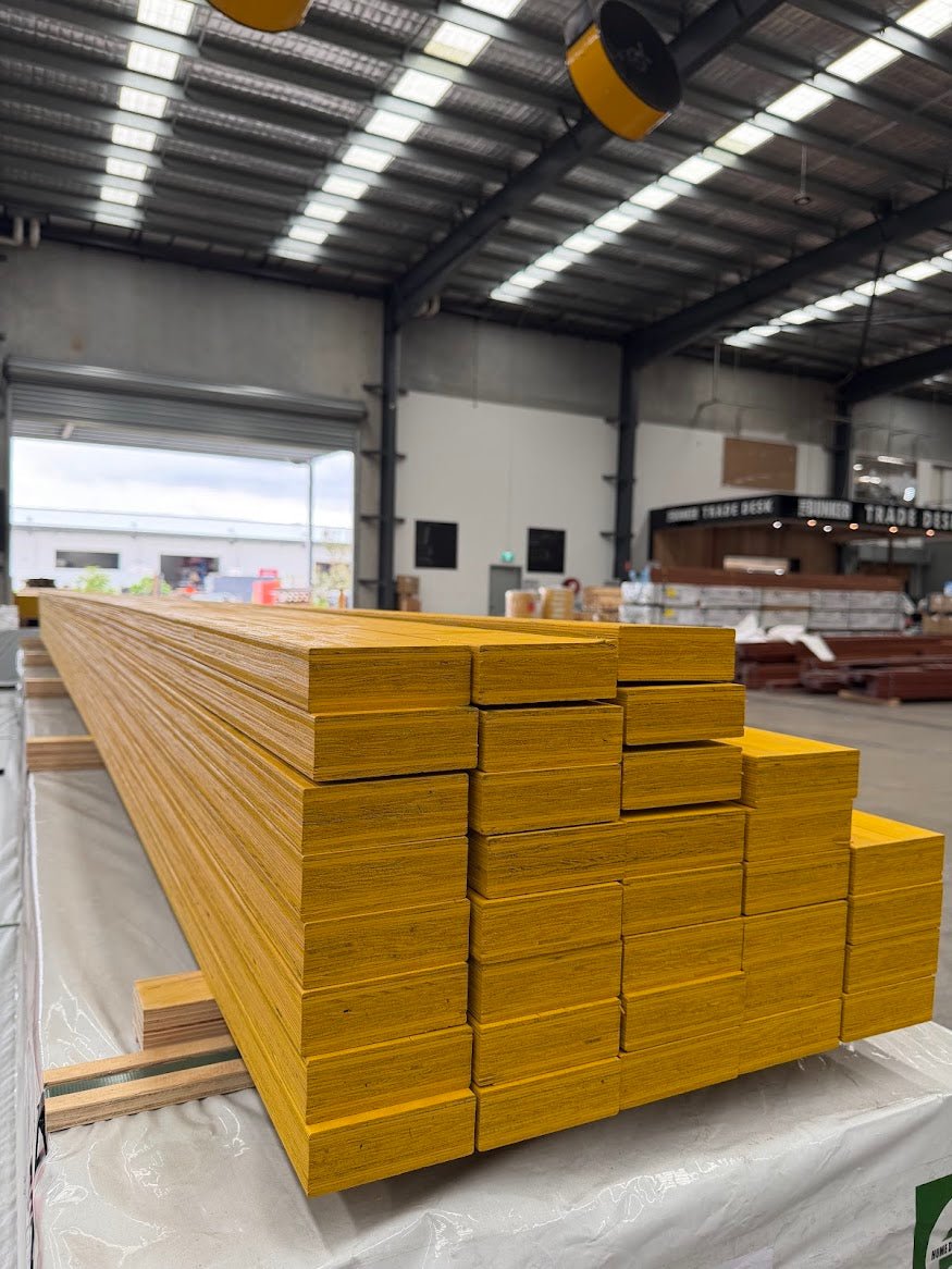 Stack of yellow H2S LVL beams 190 x 45mm in warehouse