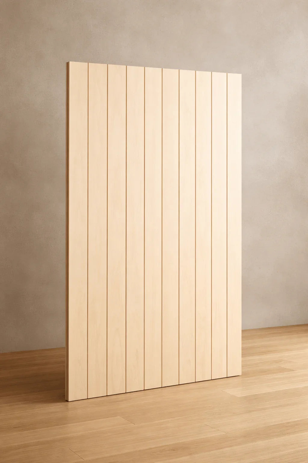Close-up of V-groove plywood panel showing linear groove spacing