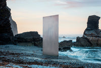 Innova Earthstone Patina Grey fibre cement facade panel - official hero image, coastal setting