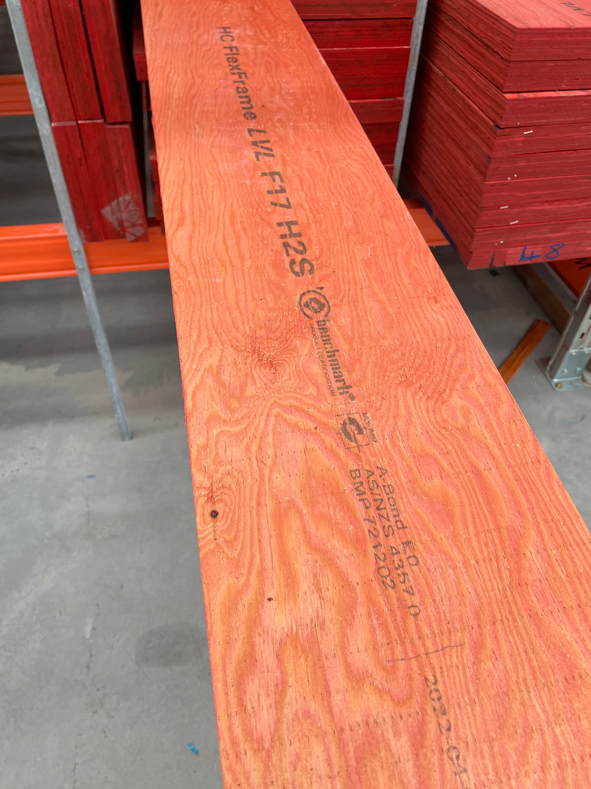 Full-length H2S LVL F17 structural beam laid on warehouse racking